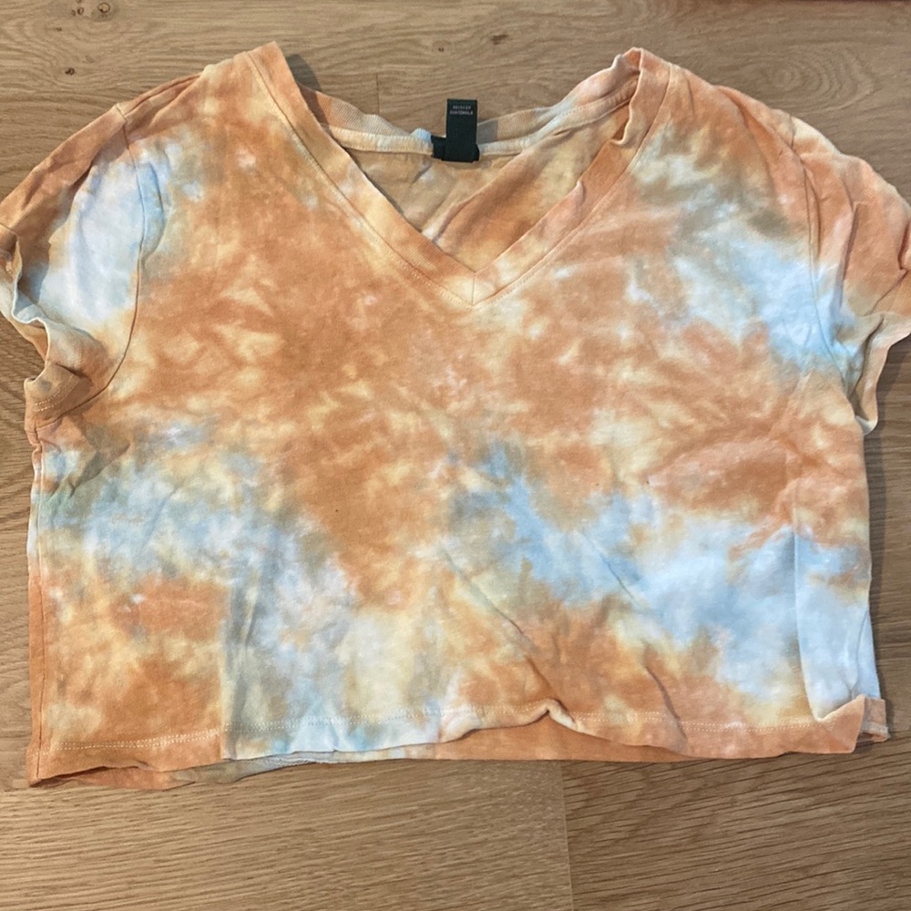Pegs and blue tie dye shirt